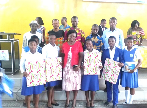 The contestants in the company of some of their teachers displaying their prizes The contestants in the company of some of their teachers displaying their prizes